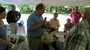 Jack accepting the Award from PDG Jim Holden. Pictured L-R: Jenny Goodemote, Gehrig Lohrman, PDG Jim Holden (seated), Jane Holden, Rhoda Childs (seated), Joe Kardash, and Len Kane.